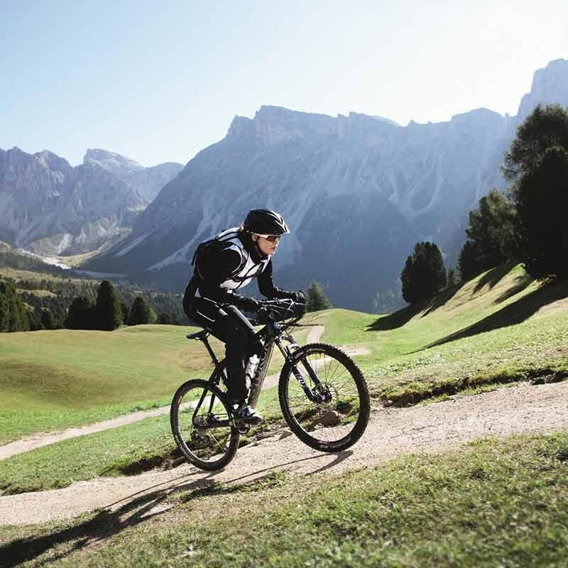 Person mountain biking